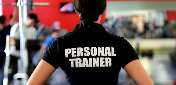 Woman with persnal trainer written on the back of her shirt